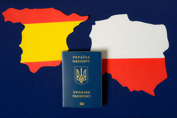 Ukrainian passport. Poland map. Spain map. Blue background of European Union Flag. Ukraine population migration. War. Threat of life.