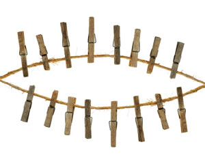 Old wooden clothespins, laundry hooks, on hemp rope, white background
