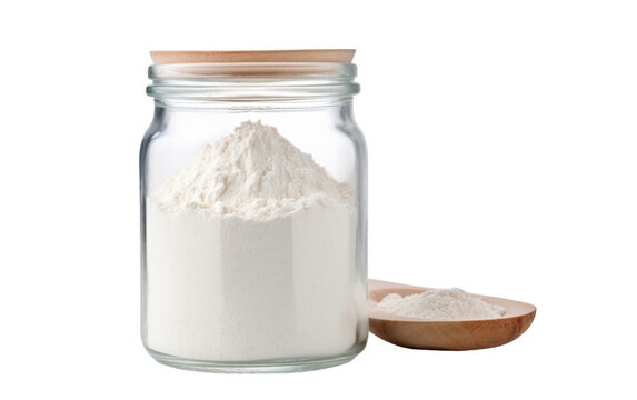 Glass jar filled with white powder sits next to a wooden spoon