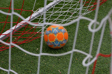 soccer ball in the grass on the football field