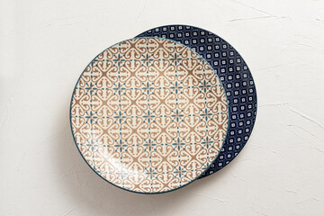 Empty porcelain plates on a white background.