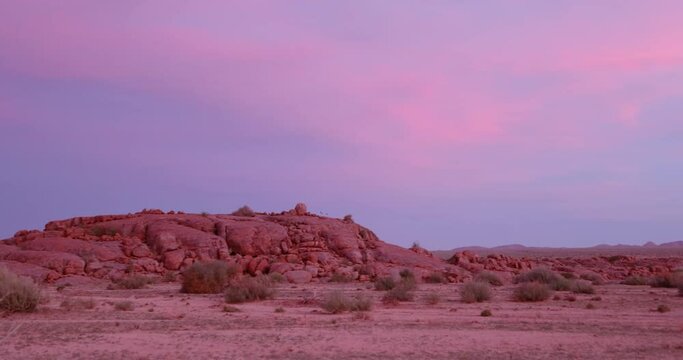 Video of a colorful sunset over the veld in southern Namibia with a pink play of colors