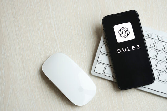 KYIV, UKRAINE - MARCH 17, 2024 Dall-E 3 logo on iPhone display screen with apple keyboard and mouse on table. Artificial Intelligence engine
