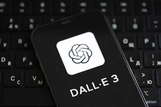 KYIV, UKRAINE - MARCH 17, 2024 Dall-E 3 logo on iPhone display screen and MacBook keyboard. Artificial Intelligence engine