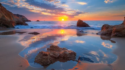 Foto op Canvas A sunset over a beach with rocks and water, AI © starush