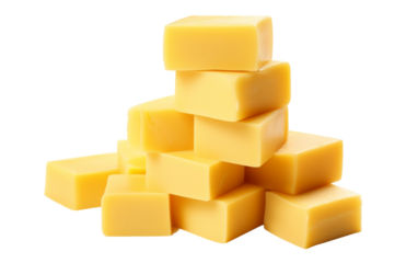 A pile of cubes of cheese on a white background