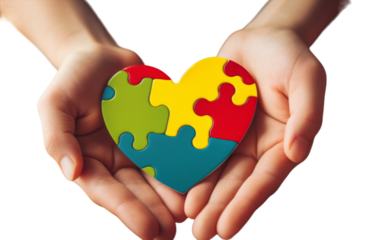 A person delicately holds a puzzle heart in their hands, symbolizing love and connection