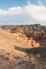 Sunset view of Charyn canyon located in the Almaty region of Kazakhstan, vertical shot