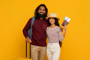 Traveling couple with luggage and passports