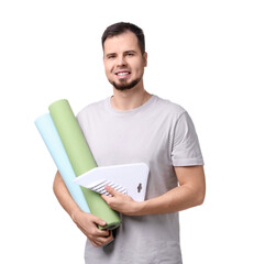Man with wallpaper rolls and spatula on white background