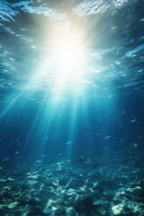 Obraz premium A bright sun is shining through the water, illuminating the ocean floor. The water is clear and blue, and there are many fish swimming around. The scene is peaceful and serene