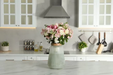 Gordijnen Beautiful bouquet of fresh flowers in vase on table indoors © New Africa