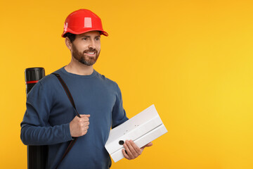 Architect in hard hat with drawing tube and folders on orange background, space for text