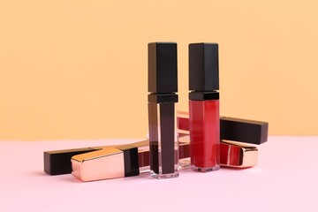 Many different lip glosses on color background © New Africa