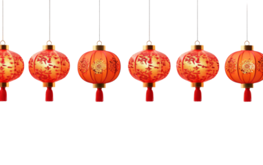 A group of vibrant red lanterns sway gently from strings in a mesmerizing display of color and light