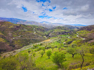 View of the Alpujarra and the road to Lobras, Province of Granada - 772196322