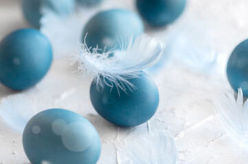 Blue easter eggs on light background