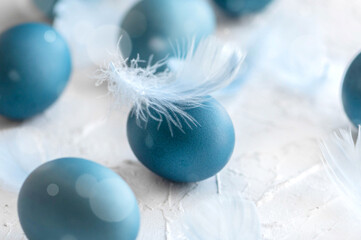 Blue easter eggs on light background