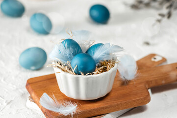 Blue easter eggs on light background