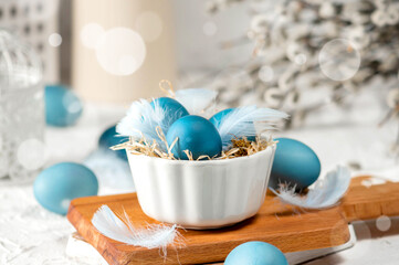 Blue easter eggs on light background
