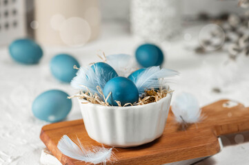 Blue easter eggs on light background