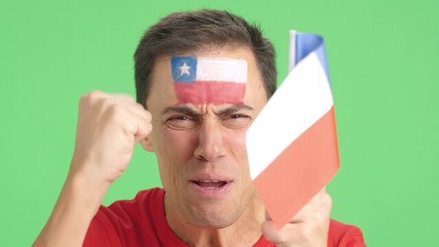 Close up of a man supporting chilean team
