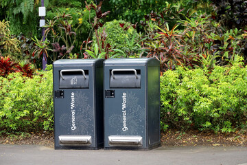 trash can with the words general waste in a park in singapore
