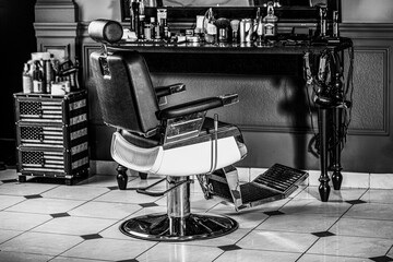 Professional hairstylist in barbershop interior. Barber chairs in interior. Theme for hairdressers,...