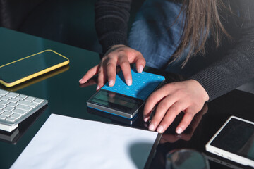Woman using calculator. Planning budget