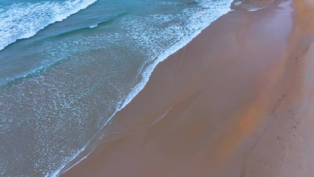 Waves and designs on the beach of Lua&ntilde;a or C&oacute;breces. Aerial view from a drone. Alfoz de Loredo Municipality. Cantabrian Sea. Cantabria. Spain. Europe