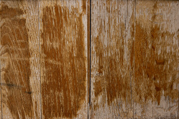 Vintage brown barrel wooden planks background texture with scratches and black stains over wood...