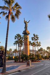 Statue La Victoria on sunrise in Banus, Spain