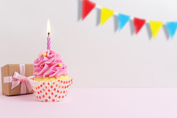 Colorful celebration background with cupcake. Minimal party concept.