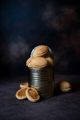 Delicious homemade cookies nuts with boiled condensed milk in a tin can