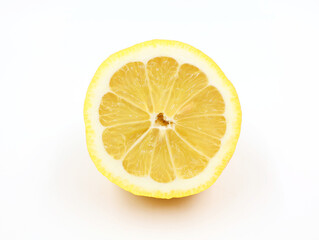 Slice of lemon isolated on white background. Flesh of a yellow citrus fruit in close-up.