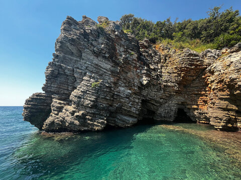 Beautiful view of the cliff near Mogren beach in the city of Budva, Montenegro.