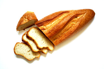 French bread sliced on white background.