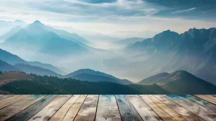 Fotobehang Misty mountains with morning light on wood deck - A serene dawn breaks over mist-covered mountains, seen from a weathered wooden deck viewpoint © Mickey