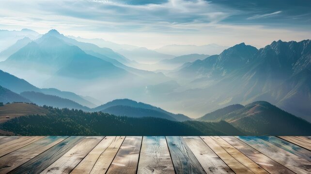 Misty mountains with morning light on wood deck - A serene dawn breaks over mist-covered mountains, seen from a weathered wooden deck viewpoint
