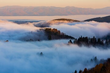 Scenic view of mountain peaks hidden in a sea of clouds. Kremnica Mountains, Slovakia.