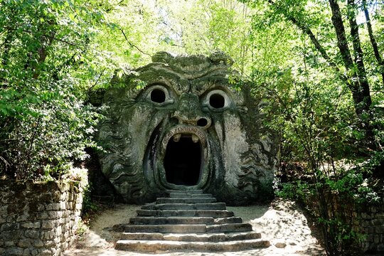 Orcus mouth sculpture at famous Parco dei Mostri (Park of the Monsters), also named Sacro Bosco (Sacred Grove) or Gardens of Bomarzo in Bomarzo. Bomarzo, Viterbo, Lazio, Italy
