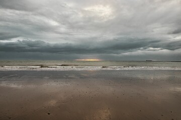 Beautiful shot of the scenic rocky White Cliff Bay of the Isle of Wight on a gloomy day