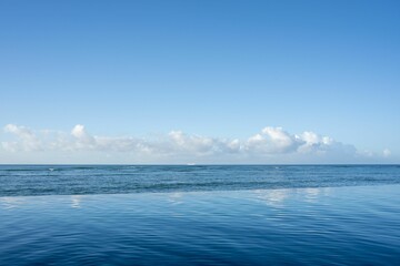 Stunningly beautiful seascape featuring a tranquil sky in all shades of blue.