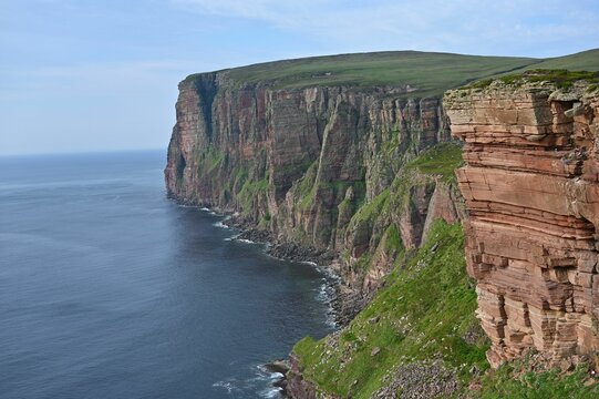 Idyllic image of rugged cliffs situated on a pristine shoreline