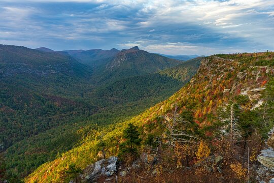 the mountains with colorful trees in the fall are majestic in color