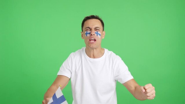 Man cheering for Finland screaming and waving a national flag