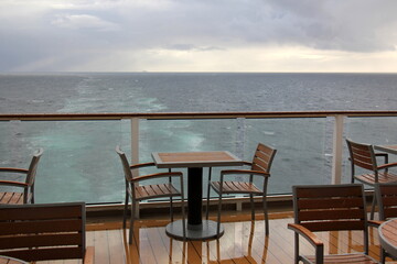 On the upper deck of a large ocean liner.