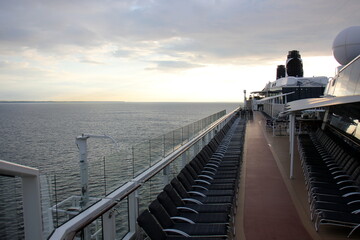 On the upper deck of a large ocean liner.