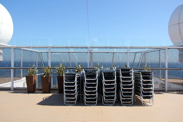 On the upper deck of a large ocean liner.