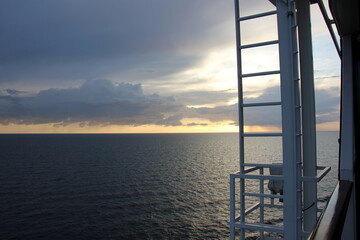 On the upper deck of a large ocean liner.